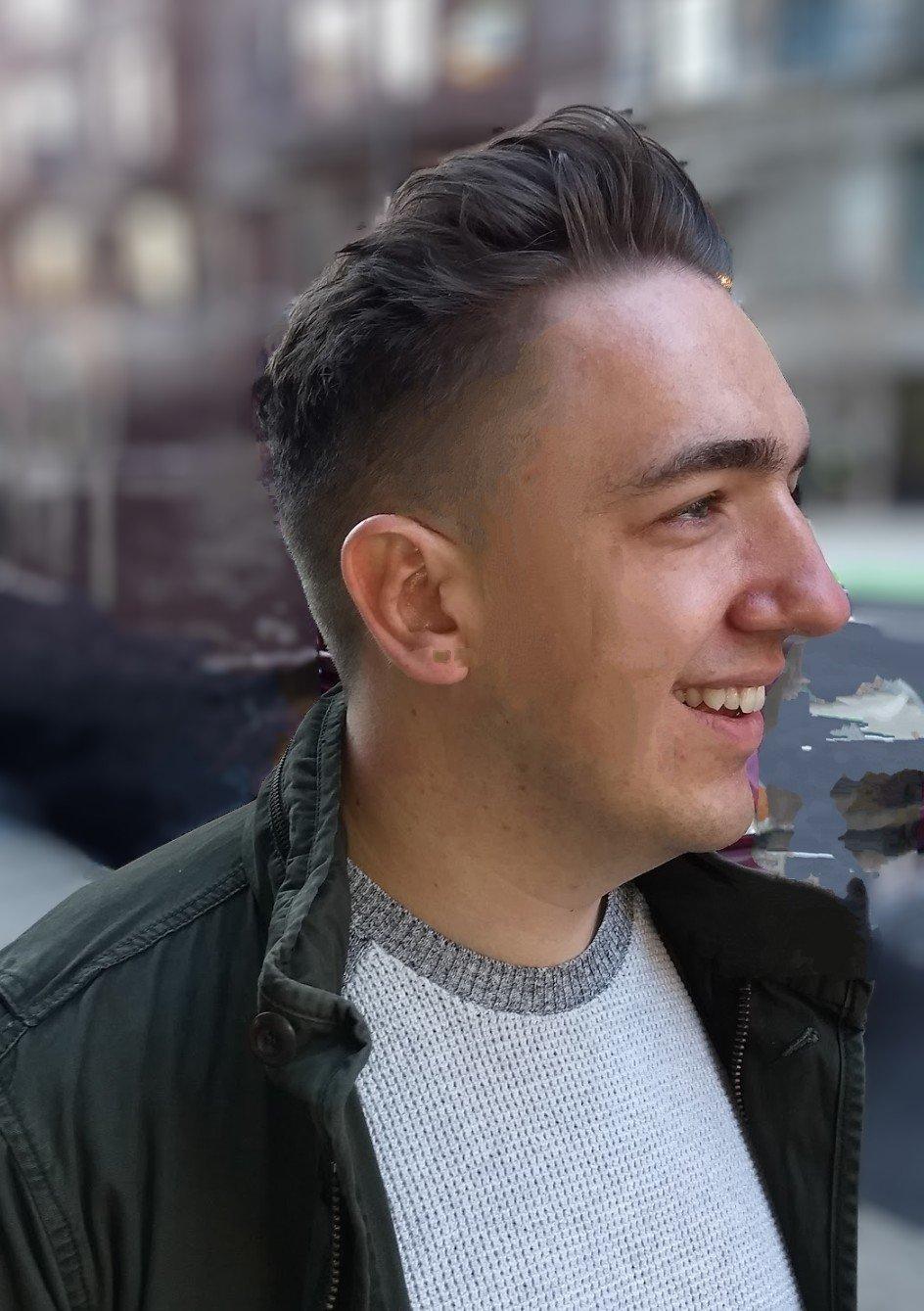 Barber sculpting beard lines